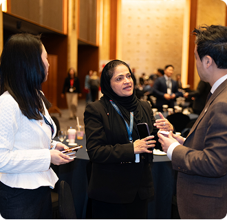 Tehmina networking with founders at an industry conference