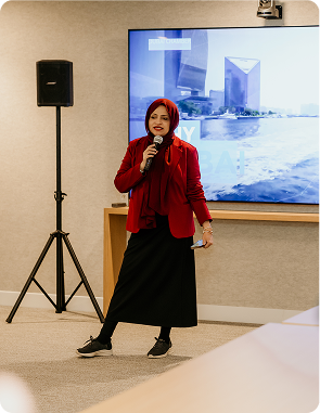 Tehmina speaking at a conference